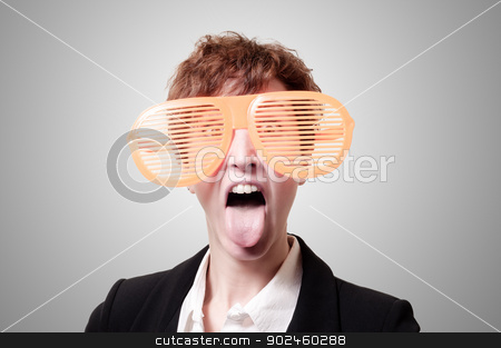 To use this stock image in your creative project, please select the size you need over to the right and click the "Add to Cart" button.
Your downloaded image will come with the Cutcaster watermark removed so don’t worry about the watermark you see on this page. businesswoman with big funny eyeglasses and tongue out stock photo, businesswoman with big funny eyeglasses and tongue out on gray background by Eugenio Marongiu