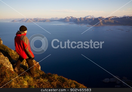 To use this stock image in your creative project, please select the size you need over to the right and click the "Add to Cart" button.
Your downloaded image will come with the Cutcaster watermark removed so don’t worry about the watermark you see on this page. Hiking in Norway stock photo, Young man on the top of mountain Festvagtinden with picturesque scenery of chain of Lofoten islands, Norway by Harvepino