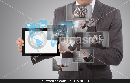 To use this stock image in your creative project, please select the size you need over to the right and click the "Add to Cart" button.
Your downloaded image will come with the Cutcaster watermark removed so don’t worry about the watermark you see on this page. holding a tablet stock photo, business man holding a tablet, grey background by matteo bragaglio