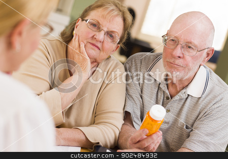 To use this stock image in your creative project, please select the size you need over to the right and click the "Add to Cart" button.
Your downloaded image will come with the Cutcaster watermark removed so don’t worry about the watermark you see on this page. Doctor or Nurse Explaining Prescription Medicine to Senior Coupl stock photo, Doctor or Nurse Explaining Prescription Medicine to Attentive Senior Couple. by Andy Dean