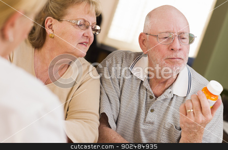 To use this stock image in your creative project, please select the size you need over to the right and click the "Add to Cart" button.
Your downloaded image will come with the Cutcaster watermark removed so don’t worry about the watermark you see on this page. Doctor or Nurse Explaining Prescription Medicine to Senior Coupl stock photo, Doctor or Nurse Explaining Prescription Medicine to Attentive Senior Couple. by Andy Dean