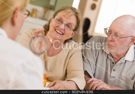 To use this stock image in your creative project, please select the size you need over to the right and click the "Add to Cart" button.
Your downloaded image will come with the Cutcaster watermark removed so don’t worry about the watermark you see on this page. Doctor or Nurse Explaining Prescription Medicine to Senior Coupl stock photo, Doctor or Nurse Explaining Prescription Medicine to Attentive Senior Couple. by Andy Dean