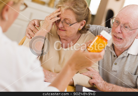 To use this stock image in your creative project, please select the size you need over to the right and click the "Add to Cart" button.
Your downloaded image will come with the Cutcaster watermark removed so don’t worry about the watermark you see on this page. Doctor or Nurse Explaining Prescription Medicine to Senior Coupl stock photo, Doctor or Nurse Explaining Prescription Medicine to Attentive Senior Couple. by Andy Dean