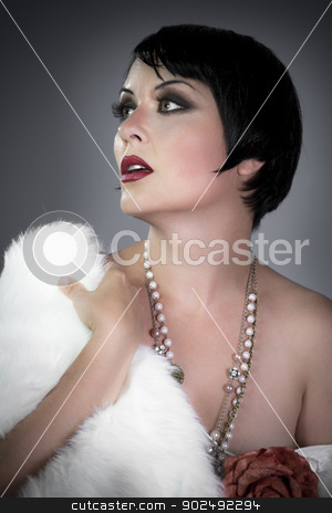 To use this stock image in your creative project, please select the size you need over to the right and click the "Add to Cart" button.
Your downloaded image will come with the Cutcaster watermark removed so don’t worry about the watermark you see on this page. sensuous short haired brunette woman, bare shoulders with white stock photo, sensuous short haired brunette woman, bare shoulders with white fur, flirty, beautiful, sweet, 20s flapper hollywood style by Fernando Cortes
