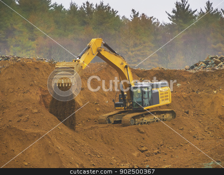 To use this stock image in your creative project, please select the size you need over to the right and click the "Add to Cart" button.
Your downloaded image will come with the Cutcaster watermark removed so don’t worry about the watermark you see on this page. Excavator shovel stock photo, Excavator shovel digging in a gravel pit by Christian Delbert