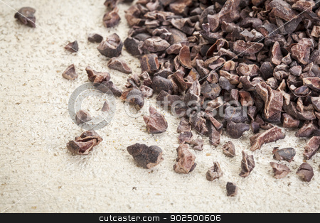 To use this stock image in your creative project, please select the size you need over to the right and click the "Add to Cart" button.
Your downloaded image will come with the Cutcaster watermark removed so don’t worry about the watermark you see on this page. raw cacao nibs stock photo, Close-up of a pile of raw cacao nibs on a rough white painted barn wood background by Marek Uliasz