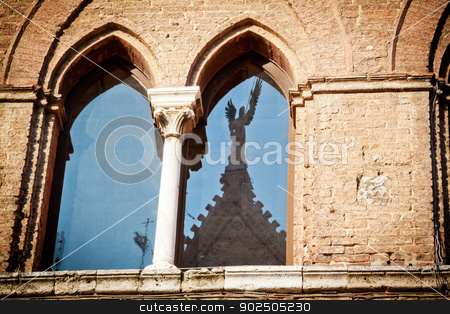 To use this stock image in your creative project, please select the size you need over to the right and click the "Add to Cart" button.
Your downloaded image will come with the Cutcaster watermark removed so don’t worry about the watermark you see on this page. Medieval window in Siena stock photo, The window of a medieval palace in Siena (Santa Maria della Scala) opposite the cathedral, with the stature of an angel reflected on the glass. by Piccia Neri