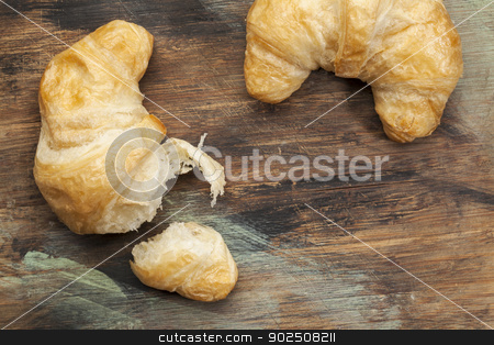 To use this stock image in your creative project, please select the size you need over to the right and click the "Add to Cart" button.
Your downloaded image will come with the Cutcaster watermark removed so don’t worry about the watermark you see on this page. croissant bakery stock photo, croissant rolls on a grunge painted wood board by Marek Uliasz