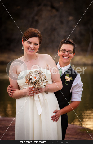 To use this stock image in your creative project, please select the size you need over to the right and click the "Add to Cart" button.
Your downloaded image will come with the Cutcaster watermark removed so don’t worry about the watermark you see on this page. Couple Posing for Civil Union stock photo, Happy gay couple standing together for civil union by Scott Griessel