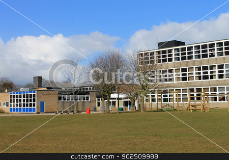 To use this stock image in your creative project, please select the size you need over to the right and click the "Add to Cart" button.
Your downloaded image will come with the Cutcaster watermark removed so don’t worry about the watermark you see on this page. Modern school building stock photo, Exterior of modern school building with playing field in foreground. by Martin Crowdy