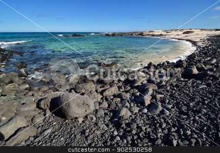 To use this stock image in your creative project, please select the size you need over to the right and click the "Add to Cart" button.
Your downloaded image will come with the Cutcaster watermark removed so don’t worry about the watermark you see on this page. Stone beach on Canary Islands, Lanzarote. Spain. stock photo, Stone beach on Canary Islands, Lanzarote. Spain. Caleta del Mojon Blanco. by Kaja Twardy