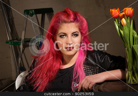 To use this stock image in your creative project, please select the size you need over to the right and click the "Add to Cart" button.
Your downloaded image will come with the Cutcaster watermark removed so don’t worry about the watermark you see on this page. Calm Woman in Pink Hair stock photo, Calm woman in pink hairdo near ladder and tulips by Scott Griessel