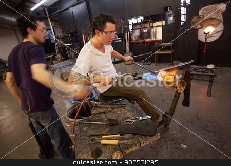 To use this stock image in your creative project, please select the size you need over to the right and click the "Add to Cart" button.
Your downloaded image will come with the Cutcaster watermark removed so don’t worry about the watermark you see on this page. Glass Workers Using Blowtorch stock photo, Two glass artists working together with blowtorch by Scott Griessel