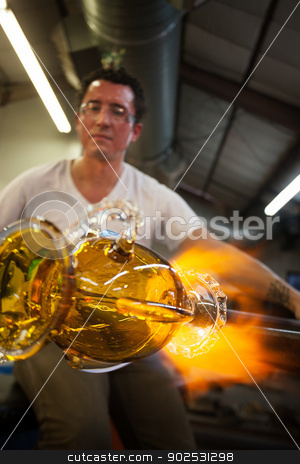 To use this stock image in your creative project, please select the size you need over to the right and click the "Add to Cart" button.
Your downloaded image will come with the Cutcaster watermark removed so don’t worry about the watermark you see on this page. Artists Sculpting Glass stock photo, Latino glass artist sculpting glass vase with blowtorch by Scott Griessel
