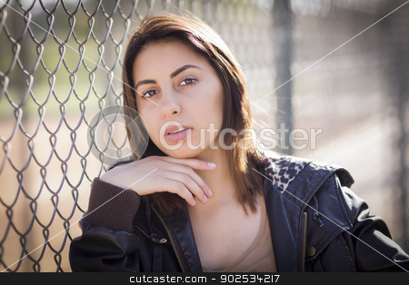 To use this stock image in your creative project, please select the size you need over to the right and click the "Add to Cart" button.
Your downloaded image will come with the Cutcaster watermark removed so don’t worry about the watermark you see on this page. Beautiful Mixed Race Young Woman stock photo, Beautiful Mixed Race Young Woman Portrait Outside Against Chain Link Fence. by Andy Dean