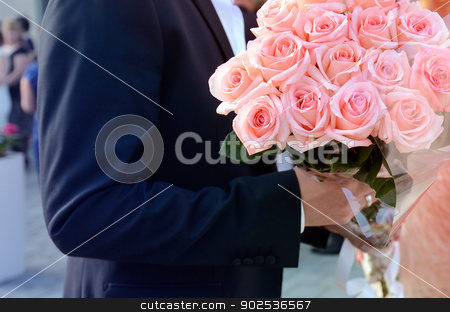 To use this stock image in your creative project, please select the size you need over to the right and click the "Add to Cart" button.
Your downloaded image will come with the Cutcaster watermark removed so don’t worry about the watermark you see on this page. Man holding bouquet in hands stock photo, Man holding imense roses bouquet in hands for a nice woman. by ifeelstock