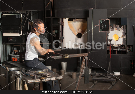 To use this stock image in your creative project, please select the size you need over to the right and click the "Add to Cart" button.
Your downloaded image will come with the Cutcaster watermark removed so don’t worry about the watermark you see on this page. Male Working on Fine Art Glass stock photo, Mature male sitting near blast furnace with fine art glass by Scott Griessel