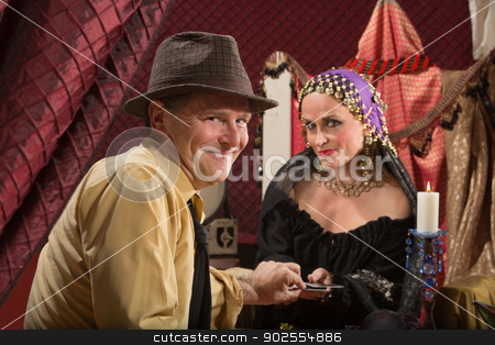 To use this stock image in your creative project, please select the size you need over to the right and click the "Add to Cart" button.
Your downloaded image will come with the Cutcaster watermark removed so don’t worry about the watermark you see on this page. Lucky Man with Fortune Teller stock photo, Lucky businessman taking tarot card from fortune teller by Scott Griessel