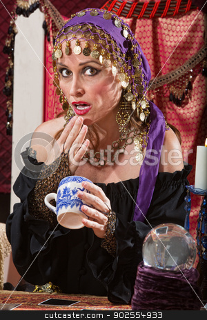 To use this stock image in your creative project, please select the size you need over to the right and click the "Add to Cart" button.
Your downloaded image will come with the Cutcaster watermark removed so don’t worry about the watermark you see on this page. Surprised Reading Tea Leaves stock photo, Surprised fortune teller reading tea leaves cup by Scott Griessel
