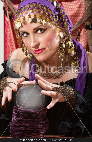 To use this stock image in your creative project, please select the size you need over to the right and click the "Add to Cart" button.
Your downloaded image will come with the Cutcaster watermark removed so don’t worry about the watermark you see on this page. Waving Over a Crystal Ball stock photo, Pretty lady waving hands over crystal ball by Scott Griessel