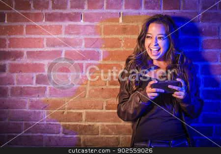 To use this stock image in your creative project, please select the size you need over to the right and click the "Add to Cart" button.
Your downloaded image will come with the Cutcaster watermark removed so don’t worry about the watermark you see on this page. Mixed Race Woman Using Her Cell Phone Against Brick Wall stock photo, Portrait of a Pretty Mixed Race Young Adult Woman Using Her Cell Phone Against a Brick Wall with Plenty of Copy Space. by Andy Dean