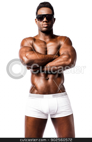 To use this stock image in your creative project, please select the size you need over to the right and click the "Add to Cart" button.
Your downloaded image will come with the Cutcaster watermark removed so don’t worry about the watermark you see on this page. Shirtless strong man with crossed arms stock photo, Muscular african guy with crossed arms facing camera by Ishay Botbol