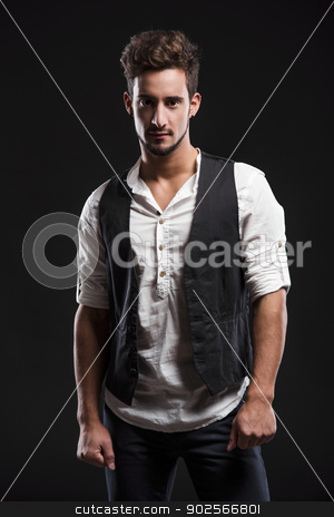 To use this stock image in your creative project, please select the size you need over to the right and click the "Add to Cart" button.
Your downloaded image will come with the Cutcaster watermark removed so don’t worry about the watermark you see on this page. Fashion young man stock photo, Studio portrait of a handsome and fashion young man, posing over a dark background by ikostudio