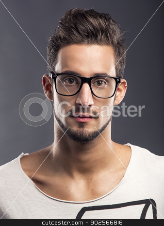 To use this stock image in your creative project, please select the size you need over to the right and click the "Add to Cart" button.
Your downloaded image will come with the Cutcaster watermark removed so don’t worry about the watermark you see on this page. Handsome young man stock photo, Casual portrait of a hansome young man wearing glasses, looking to the camera by ikostudio