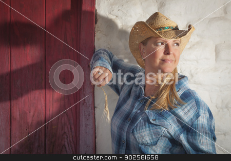 To use this stock image in your creative project, please select the size you need over to the right and click the "Add to Cart" button.
Your downloaded image will come with the Cutcaster watermark removed so don’t worry about the watermark you see on this page. Beautiful Cowgirl Against Old Wall and Red Door stock photo, Beautiful Cowgirl Wearing Cowboy Hat Leaning Against Old Adobe Wall and Red Door. by Andy Dean