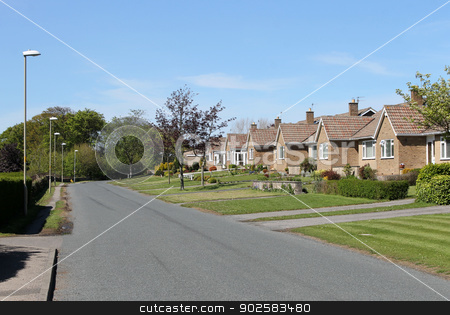 To use this stock image in your creative project, please select the size you need over to the right and click the "Add to Cart" button.
Your downloaded image will come with the Cutcaster watermark removed so don’t worry about the watermark you see on this page. Street of bungalows stock photo, Street of bungalow houses in English Village. by Martin Crowdy