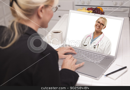 To use this stock image in your creative project, please select the size you need over to the right and click the "Add to Cart" button.
Your downloaded image will come with the Cutcaster watermark removed so don’t worry about the watermark you see on this page. Woman In Kitchen Using Laptop - Online with Nurse or Doctor stock photo, Woman In Kitchen Using Laptop - Online Chat with Nurse or Doctor on Screen. by Andy Dean