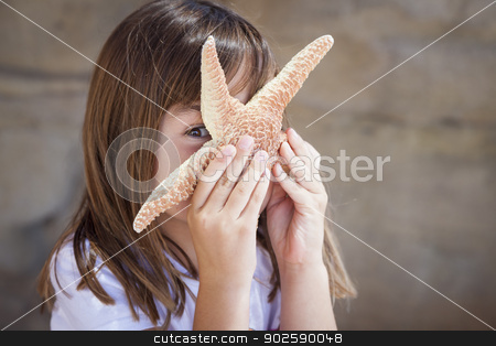 To use this stock image in your creative project, please select the size you need over to the right and click the "Add to Cart" button.
Your downloaded image will come with the Cutcaster watermark removed so don’t worry about the watermark you see on this page. Young Girl Playing with Starfish stock photo, Young Pretty Girl Playing with Starfish. by Andy Dean