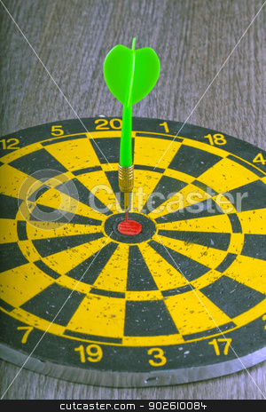 To use this stock image in your creative project, please select the size you need over to the right and click the "Add to Cart" button.
Your downloaded image will come with the Cutcaster watermark removed so don’t worry about the watermark you see on this page. Target stock photo, A green dart hitting the center of a target by Fabio Alcini