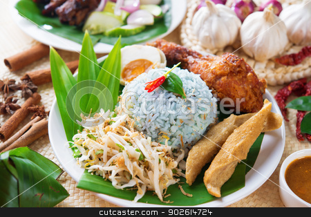 To use this stock image in your creative project, please select the size you need over to the right and click the "Add to Cart" button.
Your downloaded image will come with the Cutcaster watermark removed so don’t worry about the watermark you see on this page. Nasi kerabu stock photo, Nasi kerabu or nasi ulam, popular Malaysian Malay rice dish. Blue color of rice resulting from the petals of butterfly-pea flowers. Traditional Malaysia food, Asian cuisine. by szefei