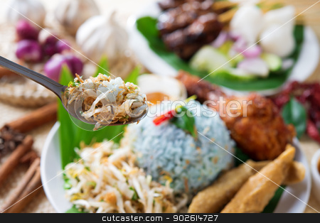 To use this stock image in your creative project, please select the size you need over to the right and click the "Add to Cart" button.
Your downloaded image will come with the Cutcaster watermark removed so don’t worry about the watermark you see on this page. Malaysia food stock photo, Nasi kerabu, famous Malaysian Malay rice dish. Traditional east coast blue rice. Popular in states such as Terengganu or Kelantan . Malaysia food, Asian cuisine. by szefei