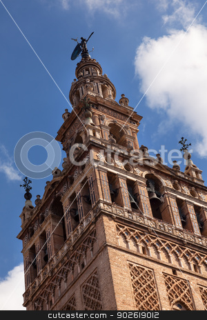 To use this stock image in your creative project, please select the size you need over to the right and click the "Add to Cart" button.
Your downloaded image will come with the Cutcaster watermark removed so don’t worry about the watermark you see on this page. Giralda Bell Tower Cathedral of Saint Mary of the See Spire Weat stock photo, Giralda Spire, Bell Tower, Seville Cathedral, Cathedral of Saint Mary of the See, Seville, Andalusia Spain. Built in the 1500s. Largest Gothic Cathedral in the World and Third Largest Church in the World. Burial Place of Christopher Columbus. Giralda is a former minaret converted into a bell tower by William Perry