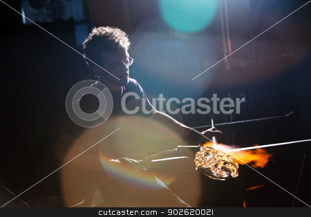 To use this stock image in your creative project, please select the size you need over to the right and click the "Add to Cart" button.
Your downloaded image will come with the Cutcaster watermark removed so don’t worry about the watermark you see on this page. Worker Creating Vase in Dark stock photo, Lens flares surround glass worker creating vase by Scott Griessel