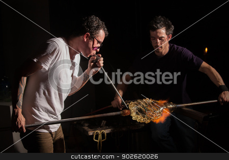 To use this stock image in your creative project, please select the size you need over to the right and click the "Add to Cart" button.
Your downloaded image will come with the Cutcaster watermark removed so don’t worry about the watermark you see on this page. Workers Forming Glass Art stock photo, Glass industry artists working with blowpipe and blowtorch by Scott Griessel