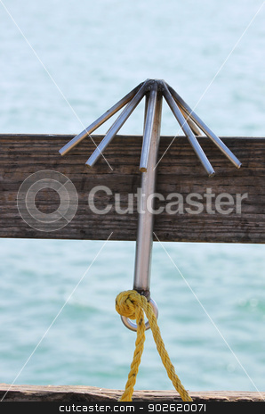 To use this stock image in your creative project, please select the size you need over to the right and click the "Add to Cart" button.
Your downloaded image will come with the Cutcaster watermark removed so don’t worry about the watermark you see on this page. Hook stock photo, A Hook hanging on a board with the ocean in the background. by Henrik Lehnerer