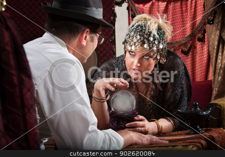 To use this stock image in your creative project, please select the size you need over to the right and click the "Add to Cart" button.
Your downloaded image will come with the Cutcaster watermark removed so don’t worry about the watermark you see on this page. Fortune Teller with Crystal Ball stock photo, Pretty female fortune teller talking to customer over crystal ball by Scott Griessel