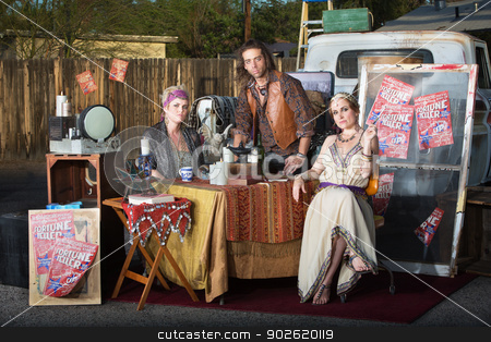 To use this stock image in your creative project, please select the size you need over to the right and click the "Add to Cart" button.
Your downloaded image will come with the Cutcaster watermark removed so don’t worry about the watermark you see on this page. Trio of Fortune Tellers stock photo, Three serious fortune tellers sitting outside at kiosk by Scott Griessel