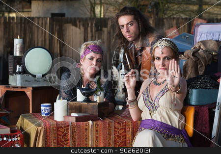 To use this stock image in your creative project, please select the size you need over to the right and click the "Add to Cart" button.
Your downloaded image will come with the Cutcaster watermark removed so don’t worry about the watermark you see on this page. Lady Showing the Evil Eye stock photo, Sexy palm reader showing the evil eye as friends look on by Scott Griessel