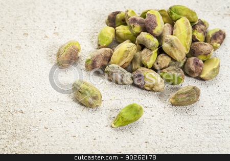 To use this stock image in your creative project, please select the size you need over to the right and click the "Add to Cart" button.
Your downloaded image will come with the Cutcaster watermark removed so don’t worry about the watermark you see on this page. raw pistachio nuts stock photo, a pile of raw pistachio nuts on a rough white painted barn wood background by Marek Uliasz