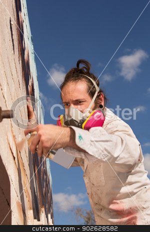 To use this stock image in your creative project, please select the size you need over to the right and click the "Add to Cart" button.
Your downloaded image will come with the Cutcaster watermark removed so don’t worry about the watermark you see on this page. Aerosol Artist Painting stock photo, European man creating spray painting art on wall by Scott Griessel