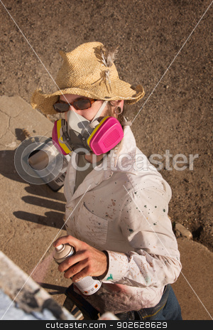 To use this stock image in your creative project, please select the size you need over to the right and click the "Add to Cart" button.
Your downloaded image will come with the Cutcaster watermark removed so don’t worry about the watermark you see on this page. Anonymous Graffit Artist stock photo, Person with hat and sunglasses spray painting a wall by Scott Griessel