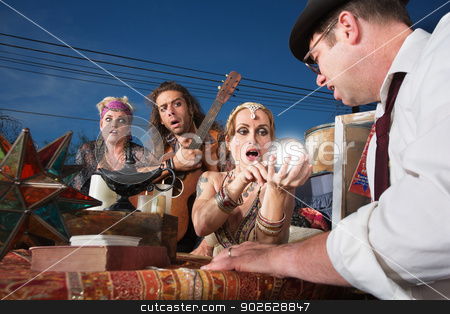 To use this stock image in your creative project, please select the size you need over to the right and click the "Add to Cart" button.
Your downloaded image will come with the Cutcaster watermark removed so don’t worry about the watermark you see on this page. Embarrassed Crystal Ball Reader stock photo, Embarrassed group of people reading a crystal ball by Scott Griessel