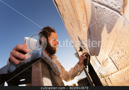 To use this stock image in your creative project, please select the size you need over to the right and click the "Add to Cart" button.
Your downloaded image will come with the Cutcaster watermark removed so don’t worry about the watermark you see on this page. Artist Creating Mural stock photo, Male graffiti artist creating mural on wall by Scott Griessel