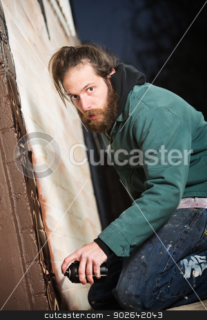 To use this stock image in your creative project, please select the size you need over to the right and click the "Add to Cart" button.
Your downloaded image will come with the Cutcaster watermark removed so don’t worry about the watermark you see on this page. Aerosol Artist Next to Wall stock photo, Adult graffit artist next to wall with spray paint can by Scott Griessel