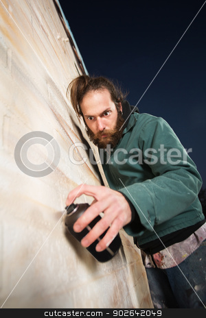 To use this stock image in your creative project, please select the size you need over to the right and click the "Add to Cart" button.
Your downloaded image will come with the Cutcaster watermark removed so don’t worry about the watermark you see on this page. Serious Bearded Man Spray Painting stock photo, Serious man with beard spray painting a wall by Scott Griessel