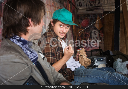 To use this stock image in your creative project, please select the size you need over to the right and click the "Add to Cart" button.
Your downloaded image will come with the Cutcaster watermark removed so don’t worry about the watermark you see on this page. Homeless Teens Talking stock photo, Two homeless teenagers with brown paper bag talking by Scott Griessel
